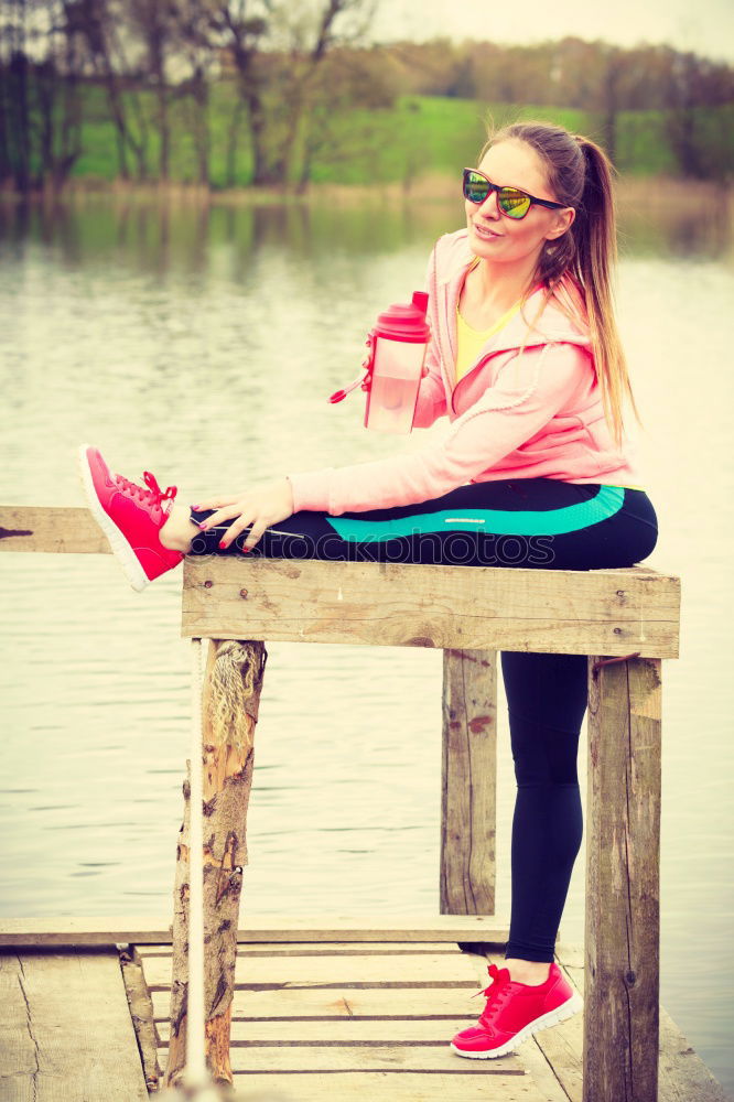 Similar – Woman stretching her body in front of ancient wall in park