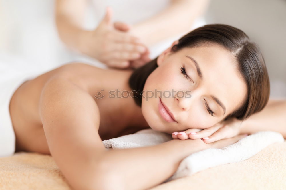 Similar – Young blond woman receiving a head massage in a spa center