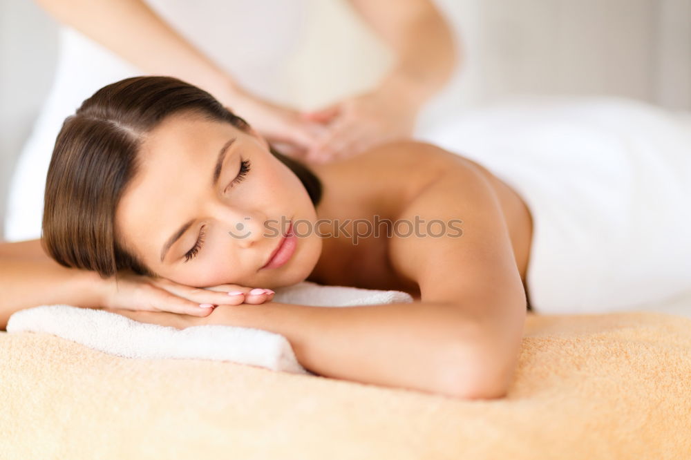 Similar – Young blond woman receiving a head massage in a spa center