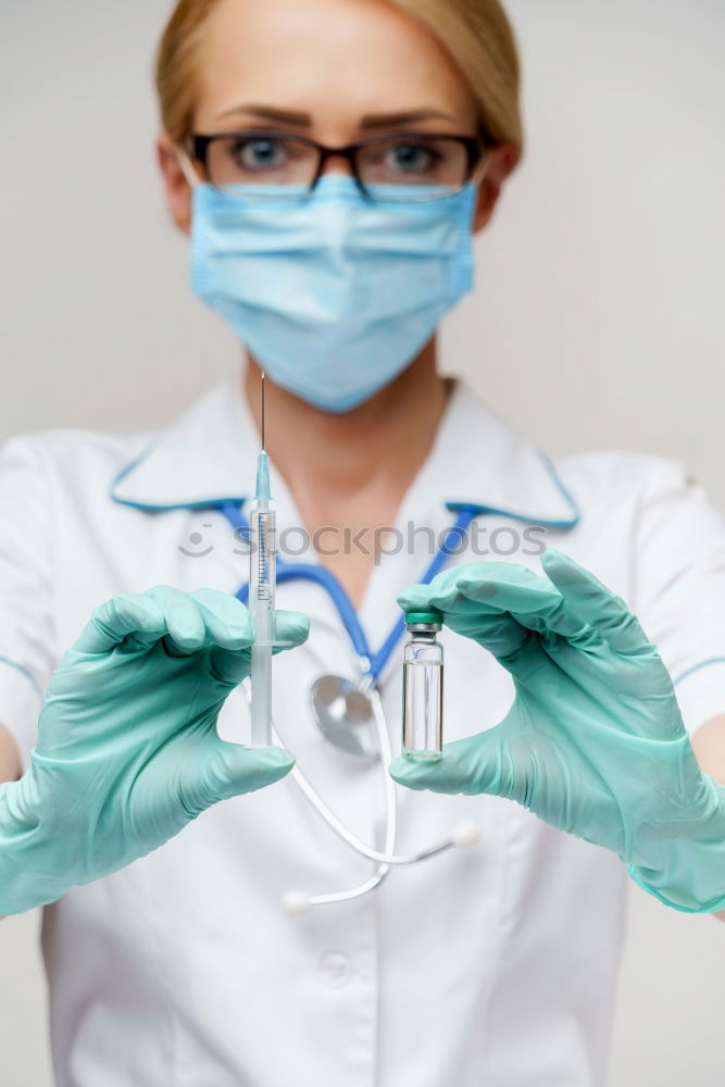 Image, Stock Photo Female doctor putting on her protective gloves