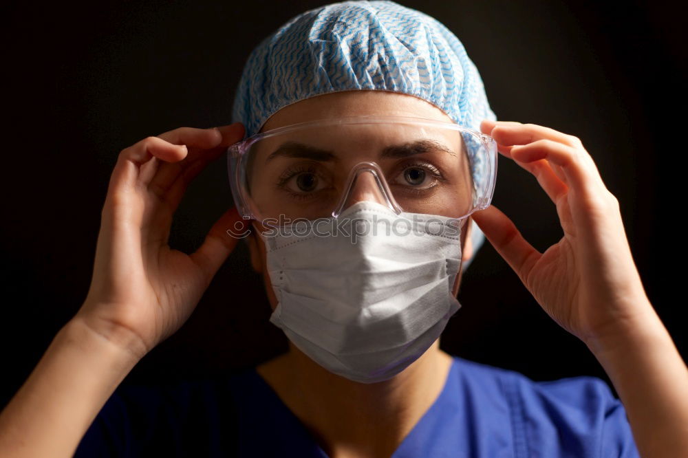 Similar – Foto Bild Konzentrierte Chirurgin bei der Arbeit