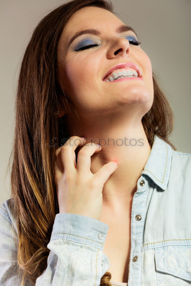 Similar – Beautiful Smiling Woman in red coat with mobile phone in hands, smartphone, urban scene