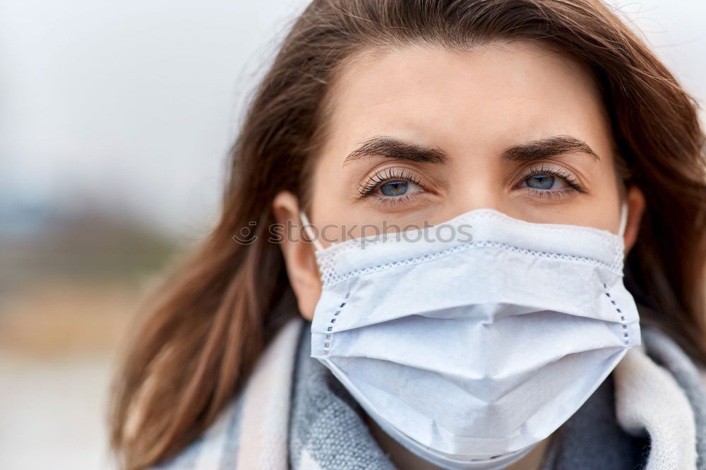 Similar – close up of Photo of a woman wearing protective mask against infectious diseases, coronavirus, covid-19 and flu outdoors. copy space. Coronavirus outbreak in Europe. Flu epidemic spread prevention