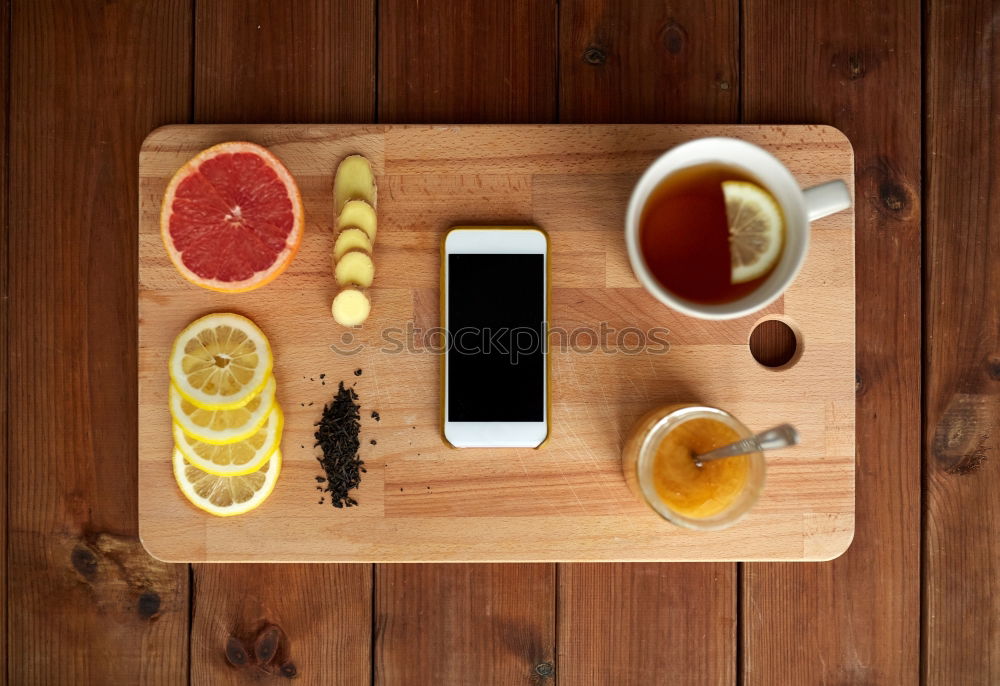 Similar – Image, Stock Photo Tea- Time: a tea cup with tea bag, sugar and cookies on a wooden table