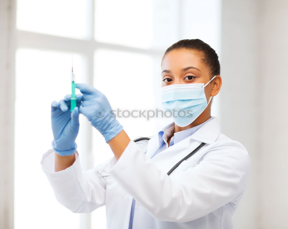 Similar – portrait of doctor woman wearing protective mask and gloves indoors. Using mobile phone. Corona virus concept