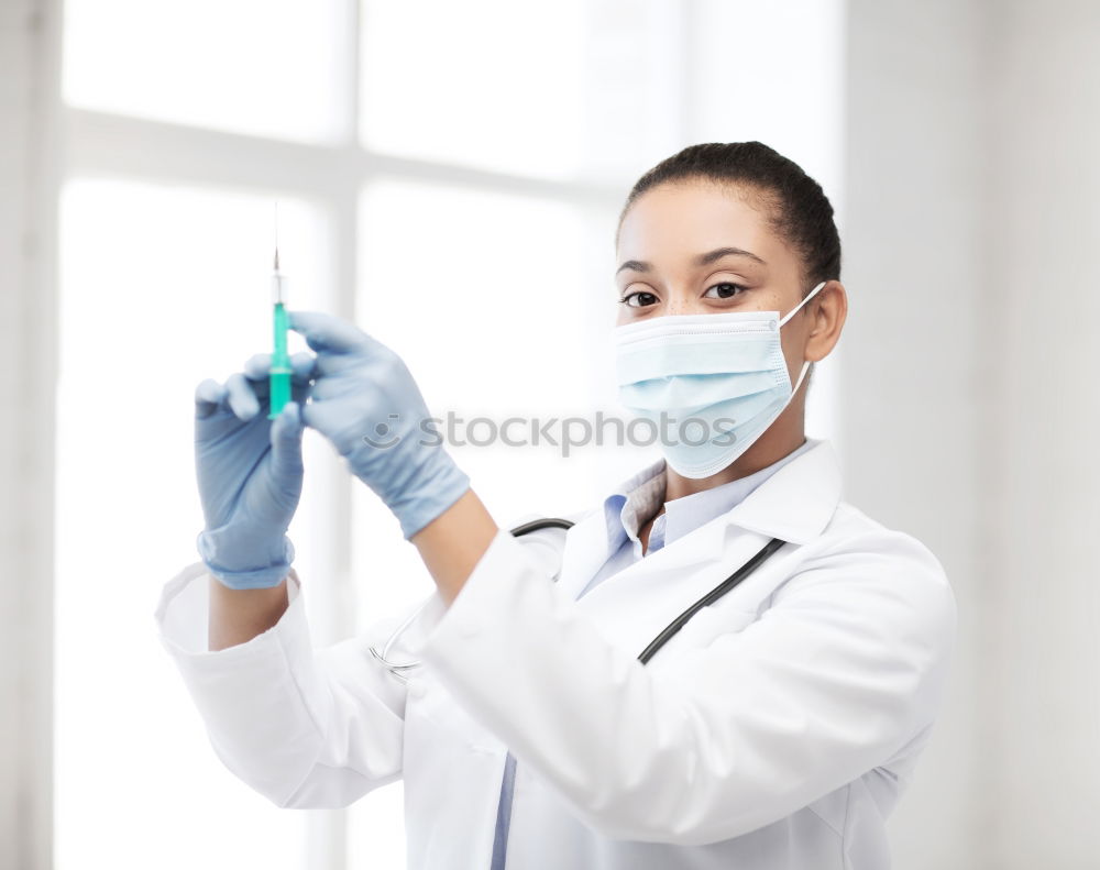 Similar – portrait of doctor woman wearing protective mask and gloves indoors. Using mobile phone. Corona virus concept