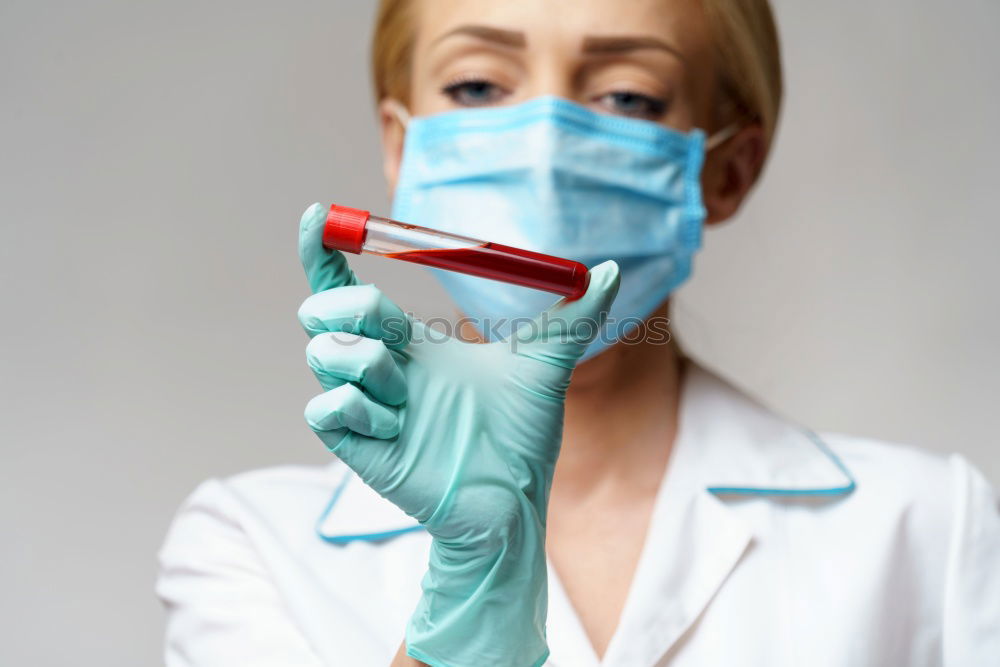 Similar – Image, Stock Photo Female doctor with face mask, protective gloves and lab coat