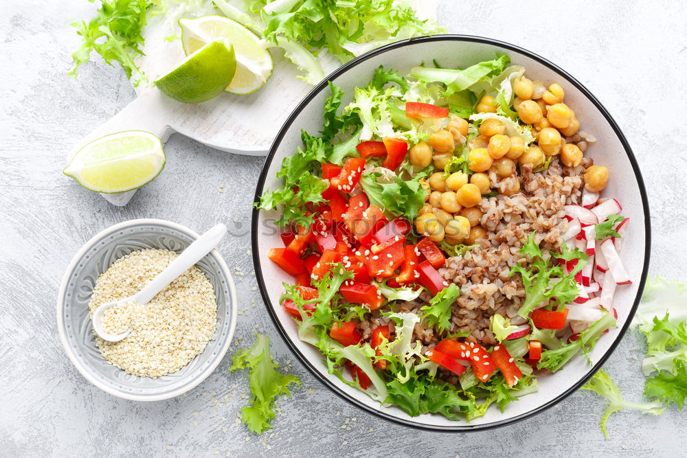 Similar – Vegan Buddha bowl with fresh raw vegetables and quinoa on wood