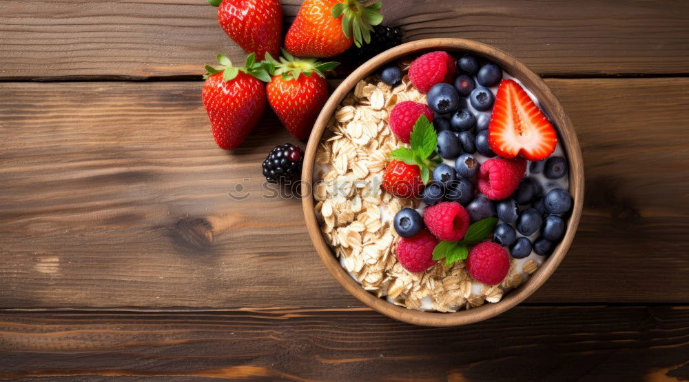 Similar – Oat flakes with berries and spoon