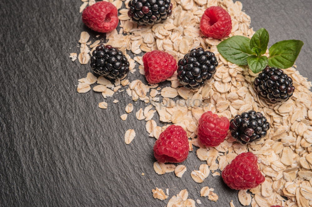 Similar – Oat flakes in blue bowl with berries