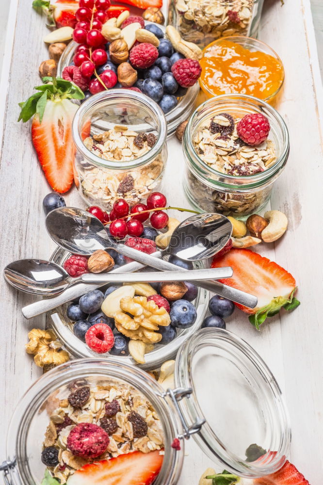 Similar – Image, Stock Photo Breakfast in glass with fresh berries, nuts and muesli