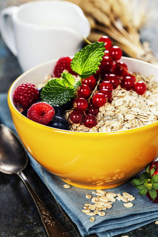 Similar – Oat flakes in blue bowl with berries