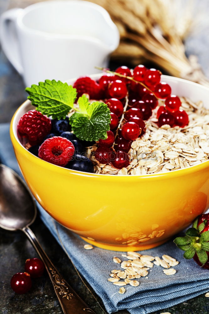 Similar – Oat flakes with berries and spoon