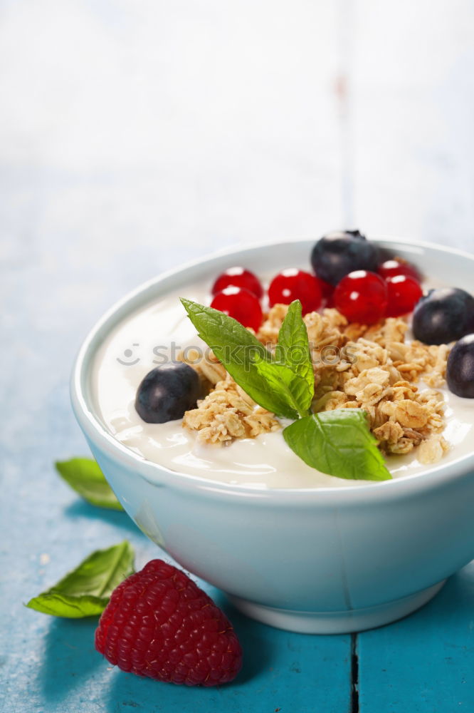 Similar – Image, Stock Photo Muesli with yoghurt and fruits on wood