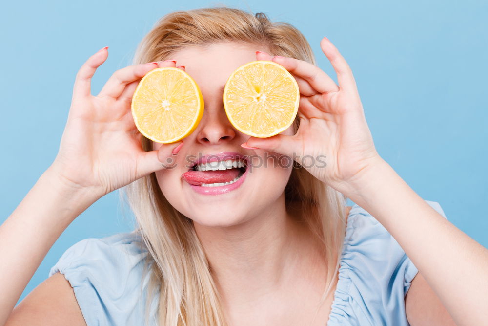 Similar – smiling little girl holding oranges over her eyes