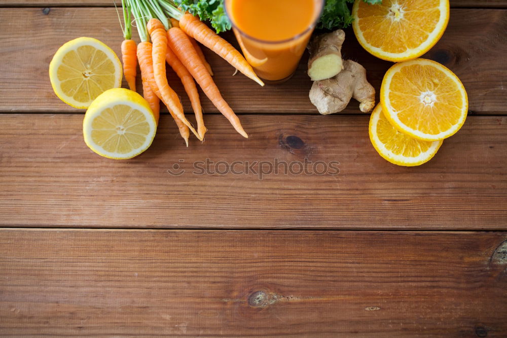 Similar – female hands holding a jar with a glass of fresh carrot juice