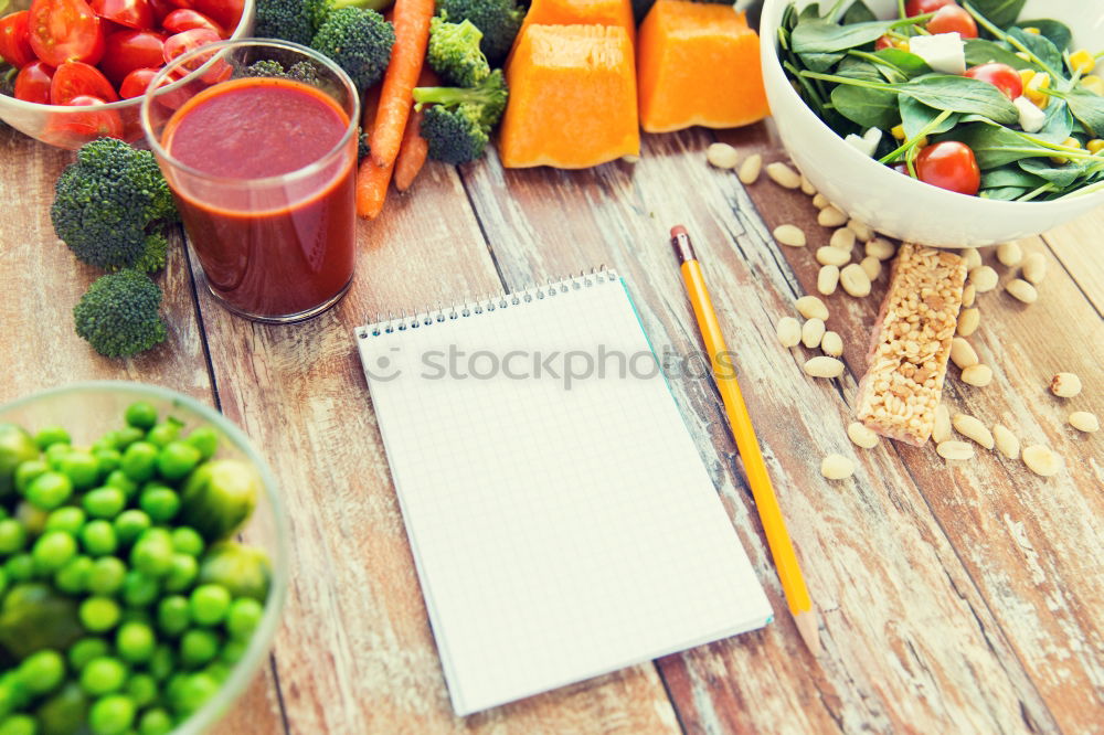 Similar – female hands holding a jar with a glass of fresh carrot juice