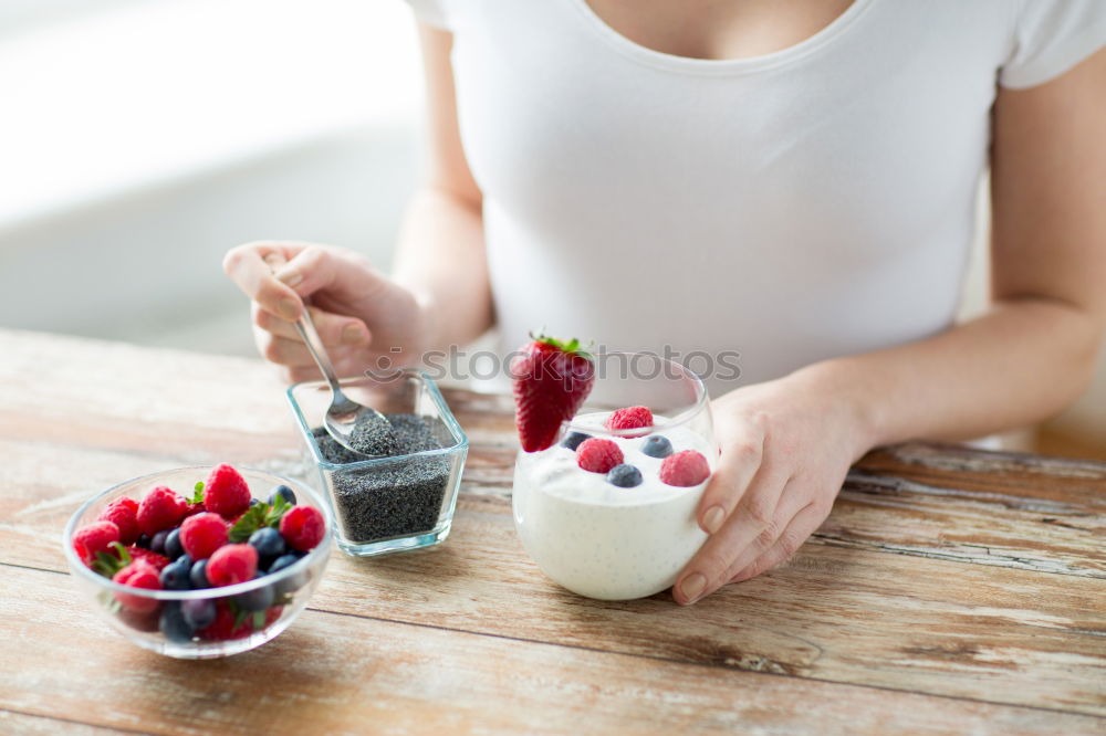 Image, Stock Photo Crop woman close up eating oat and fruits bowl for breakfast