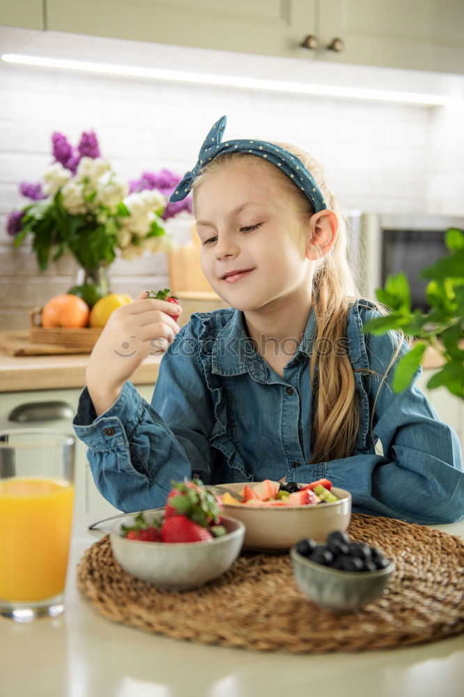 Similar – Image, Stock Photo Portrait of little girl preparing baking cookies.