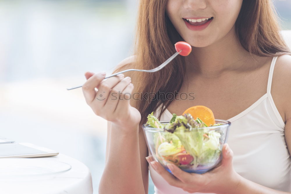 Similar – Crop woman eating sushi