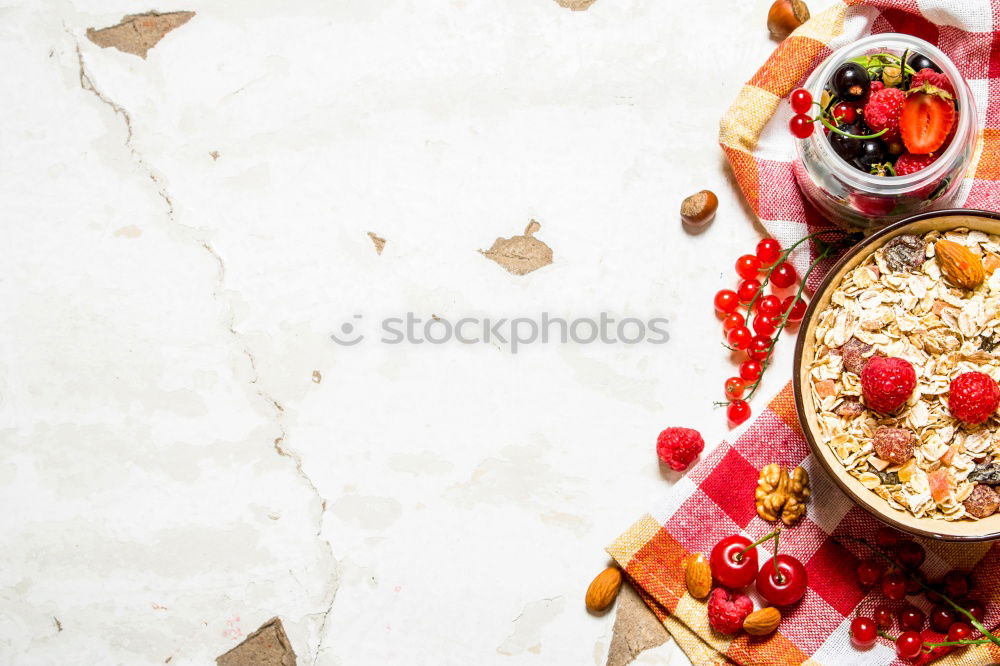 Similar – Image, Stock Photo Smoothie mango bowl with chia seeds yogurt pudding and cranberries, nuts, oatmeal topping in coconut shells with spoon. Healthy clean breakfast food. Copy space for your text or design