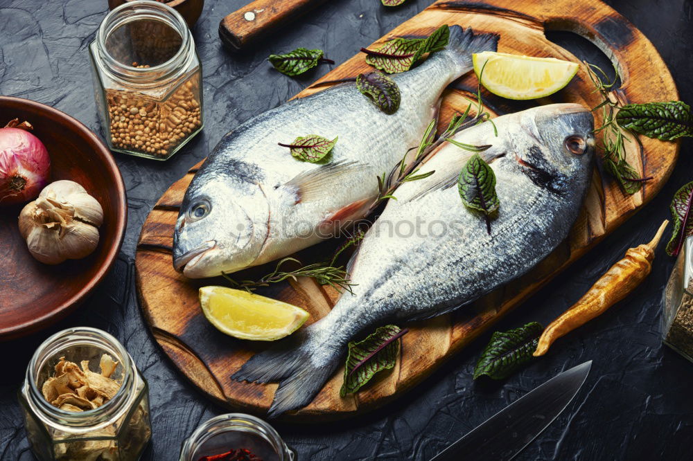 Similar – Image, Stock Photo Fish fillets with kitchen knife and spices