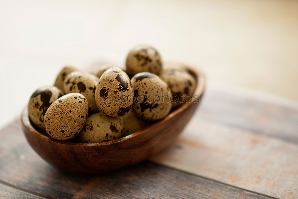 Similar – Image, Stock Photo Three fresh quail eggs on a gray wooden surface