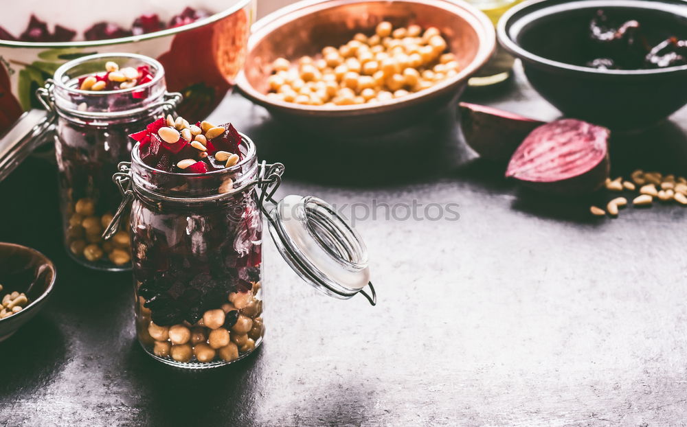 Image, Stock Photo Healthy homemade beetroot salad with chickpeas and pine nuts in glasses for lunch on dark kitchen table background with ingredients, top view. Purple vegetables eating. Clean dieting food.