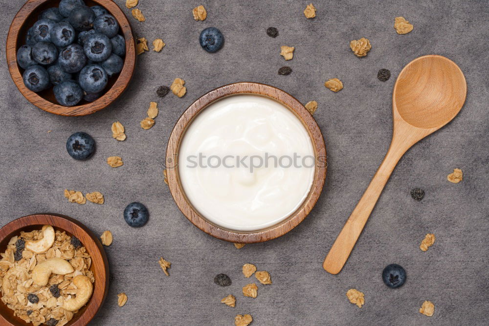Similar – Image, Stock Photo Green olives and salt in wooden bowls, top view