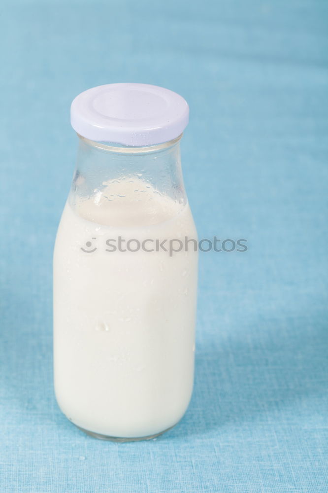 Similar – Flasche mit Milch und Glas Milch