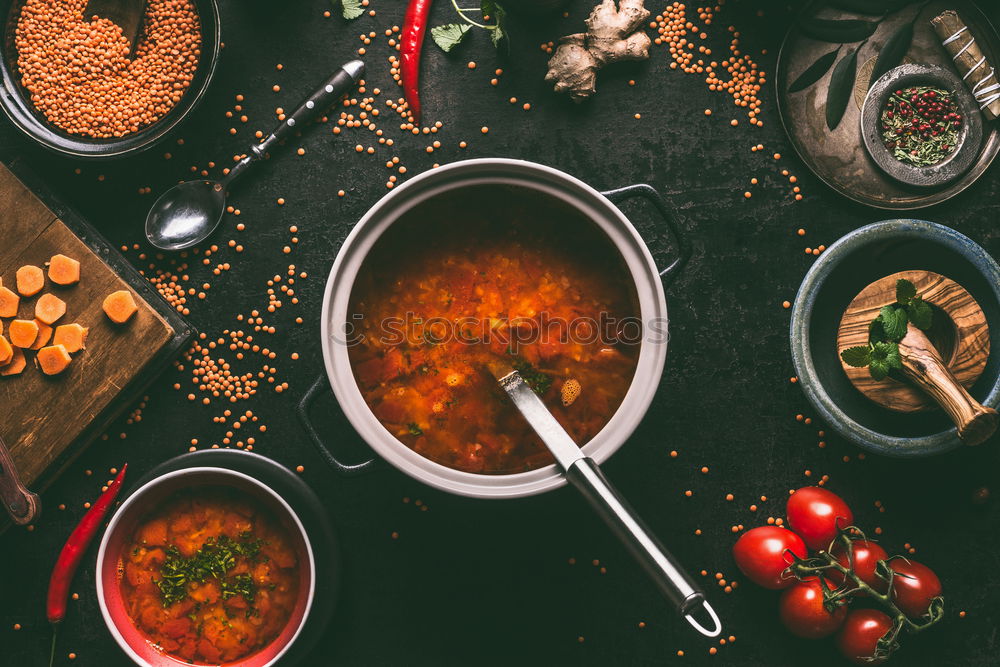 Similar – Image, Stock Photo Hands cooking orange vegetables stew