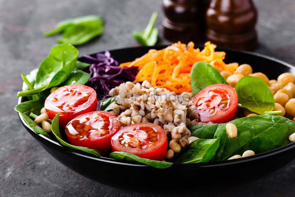 Similar – Vegan Buddha bowl with fresh raw vegetables and quinoa on wood