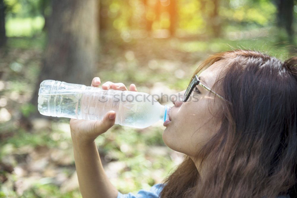 Similar – Young man drinking bottled water