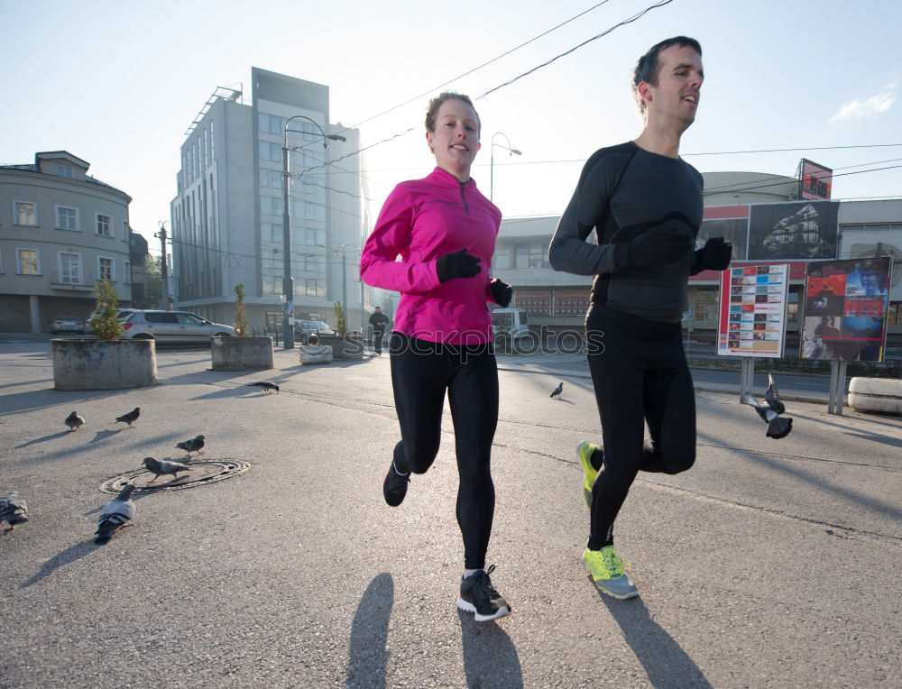 Similar – Young couple running on a seafront promenade