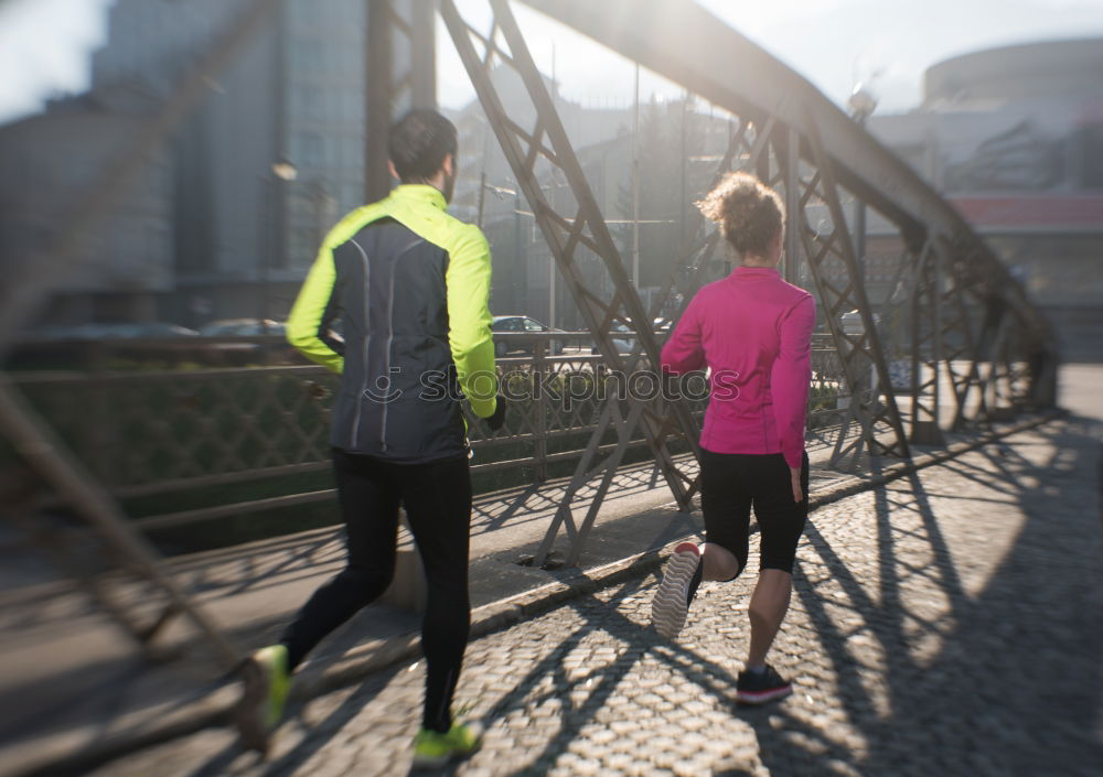 Similar – Image, Stock Photo Young couple running on a seafront promenade