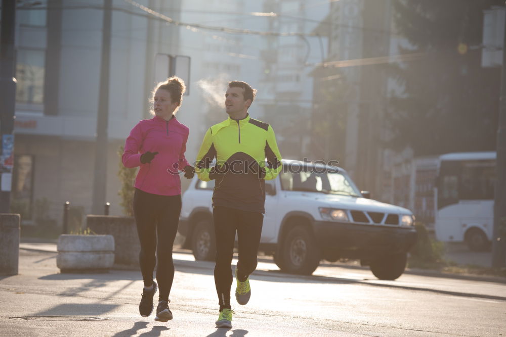 Similar – Young couple running on a seafront promenade