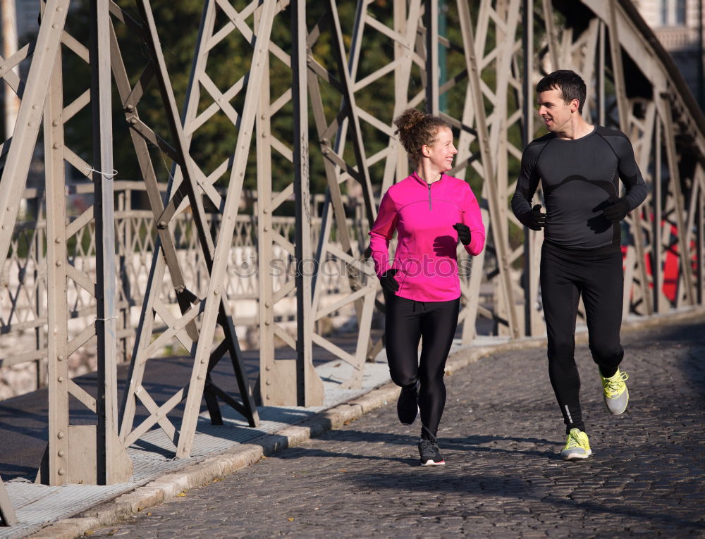 Similar – Active young couple jogging in an urban street