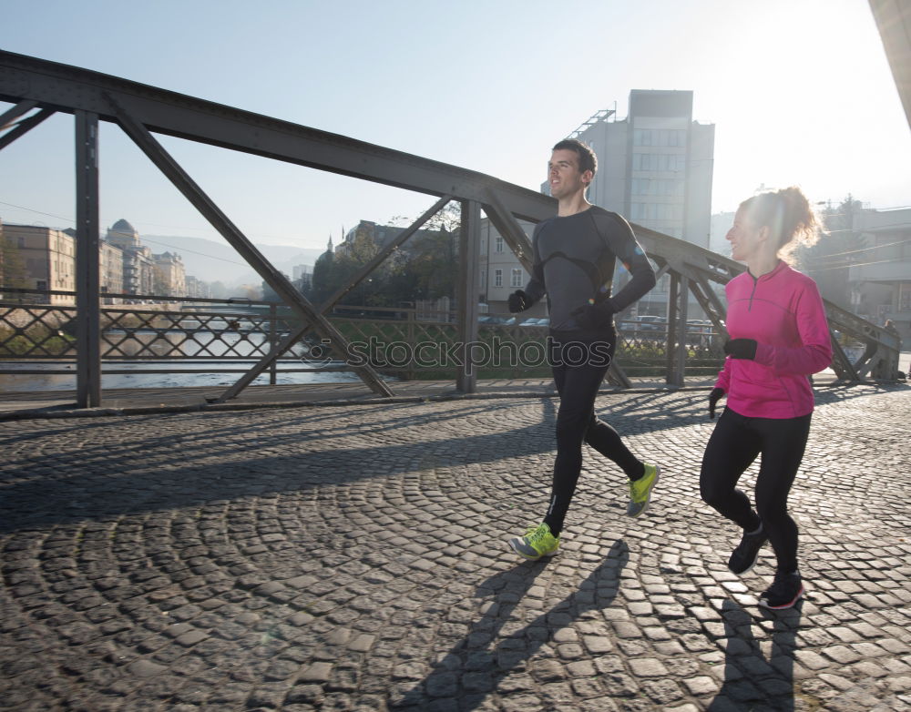 Similar – Image, Stock Photo Young couple running on a seafront promenade