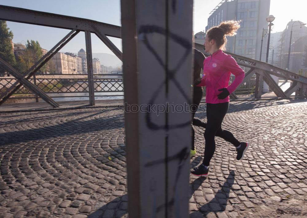 Similar – Woman stretching her body in front of ancient wall in park