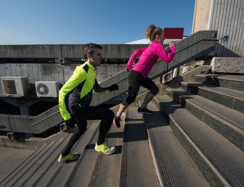 Similar – Active young couple jogging in an urban street