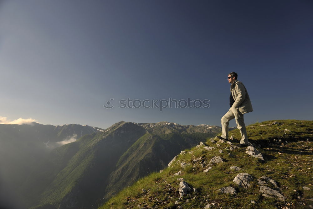 Similar – Image, Stock Photo Backpacker resting.