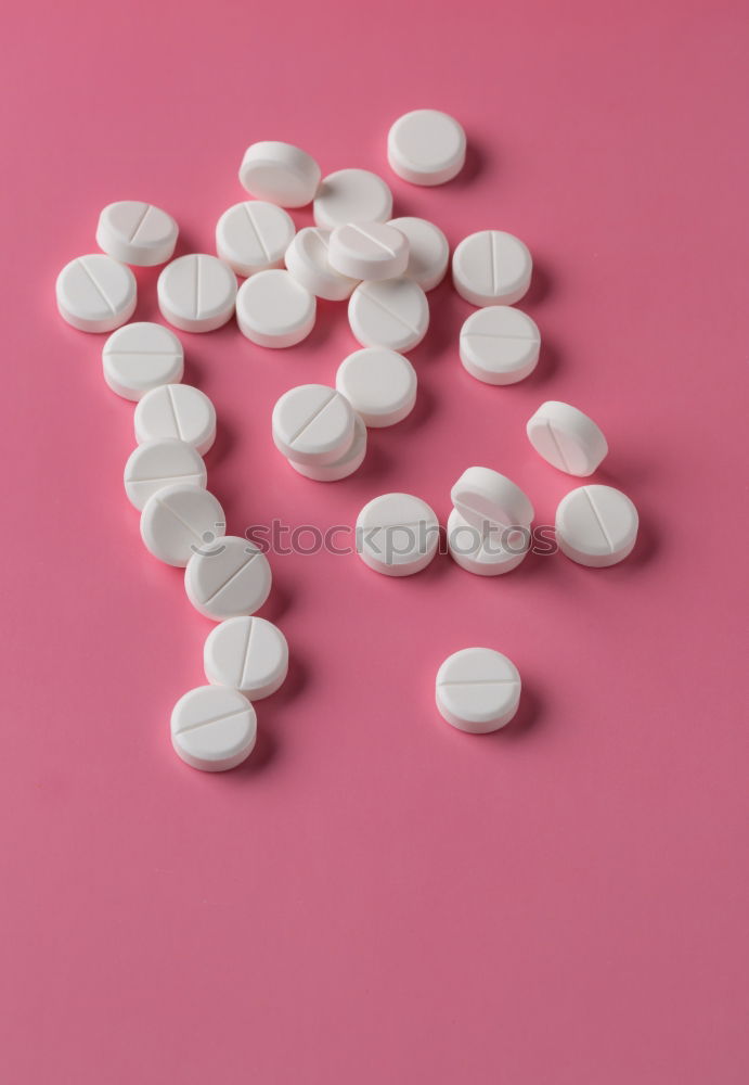 Similar – Pink tablets pill on blur blister pack of tablets pills on pink background. Prescription drugs. Woman health concept. Pharmaceutical industry. Online pharmacy banner. Drugs packaging. Treatment dose.