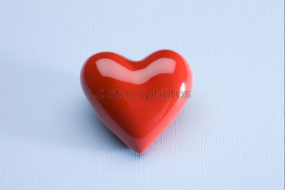 Similar – Image, Stock Photo Three stitched toy hearts, pink, red and teal on blue felt