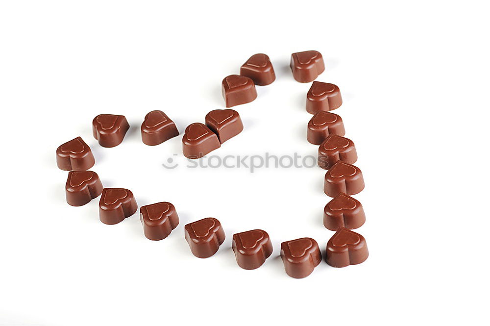 Similar – Image, Stock Photo Number 3 laid out of small chocolate candies with colored sugar sprinkles on white background