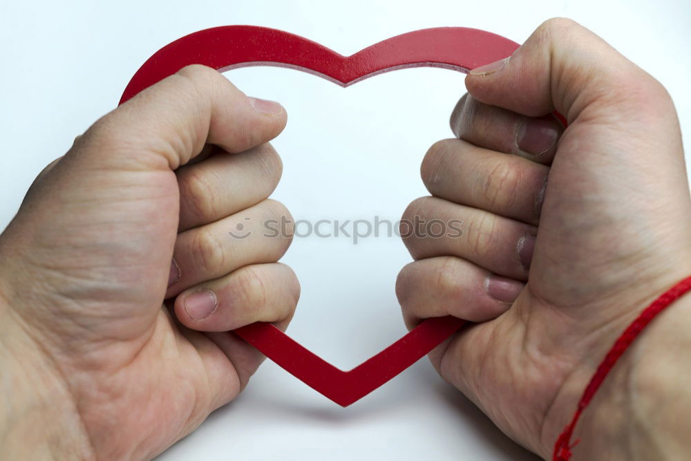 Similar – A rock with the word love written on it.