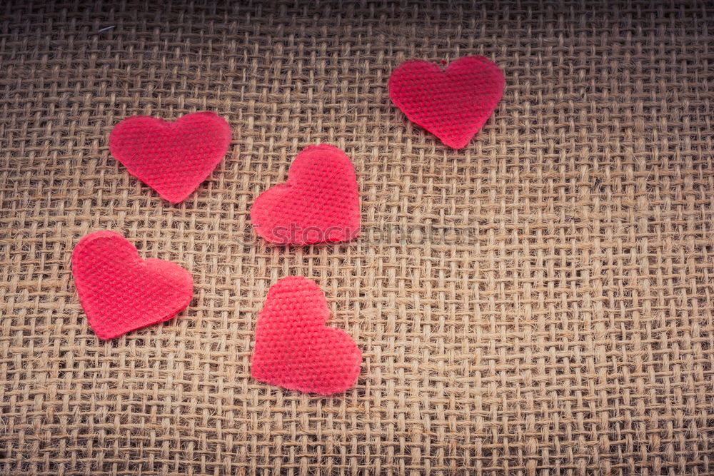 Similar – Image, Stock Photo Red heart shaped wooden sewing buttons on canvas