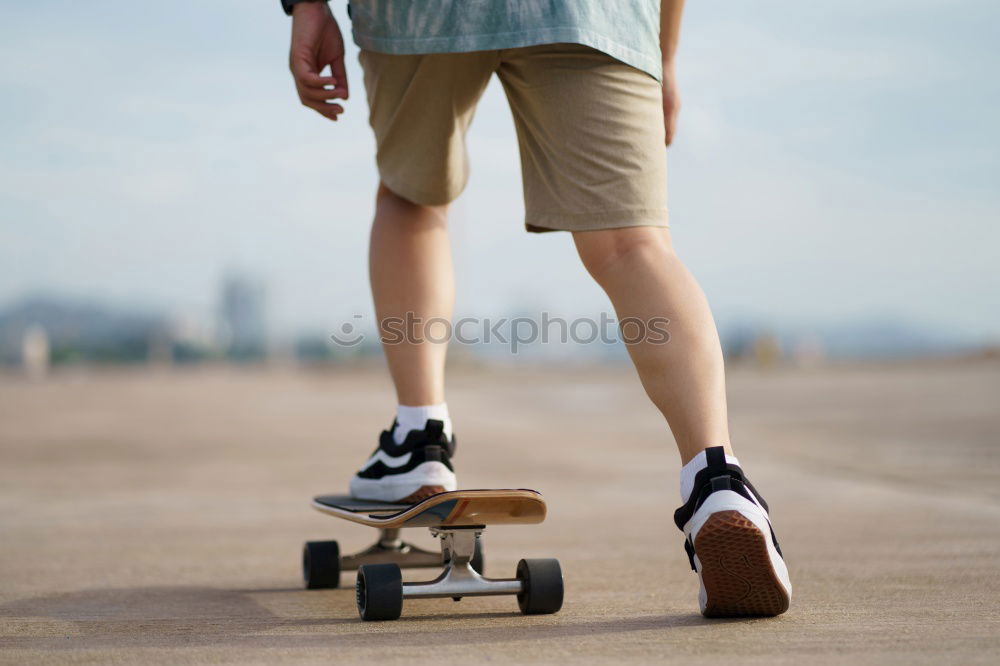 Similar – Tattooed man sitting on skateboard