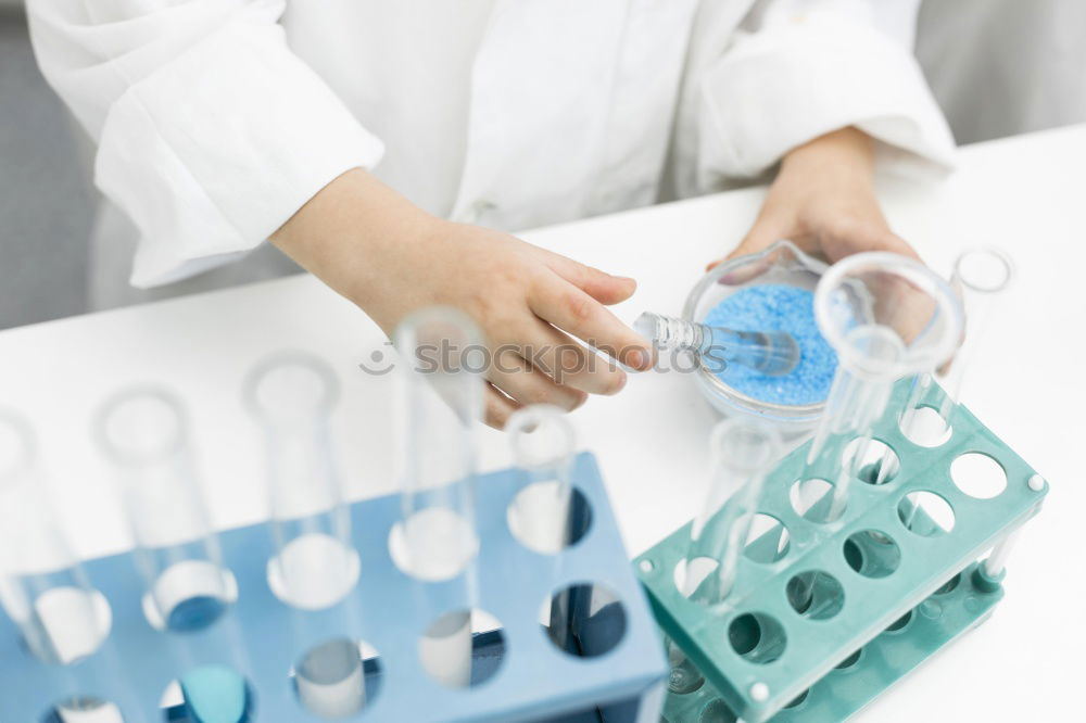 Similar – Worker putting liquid to test tube