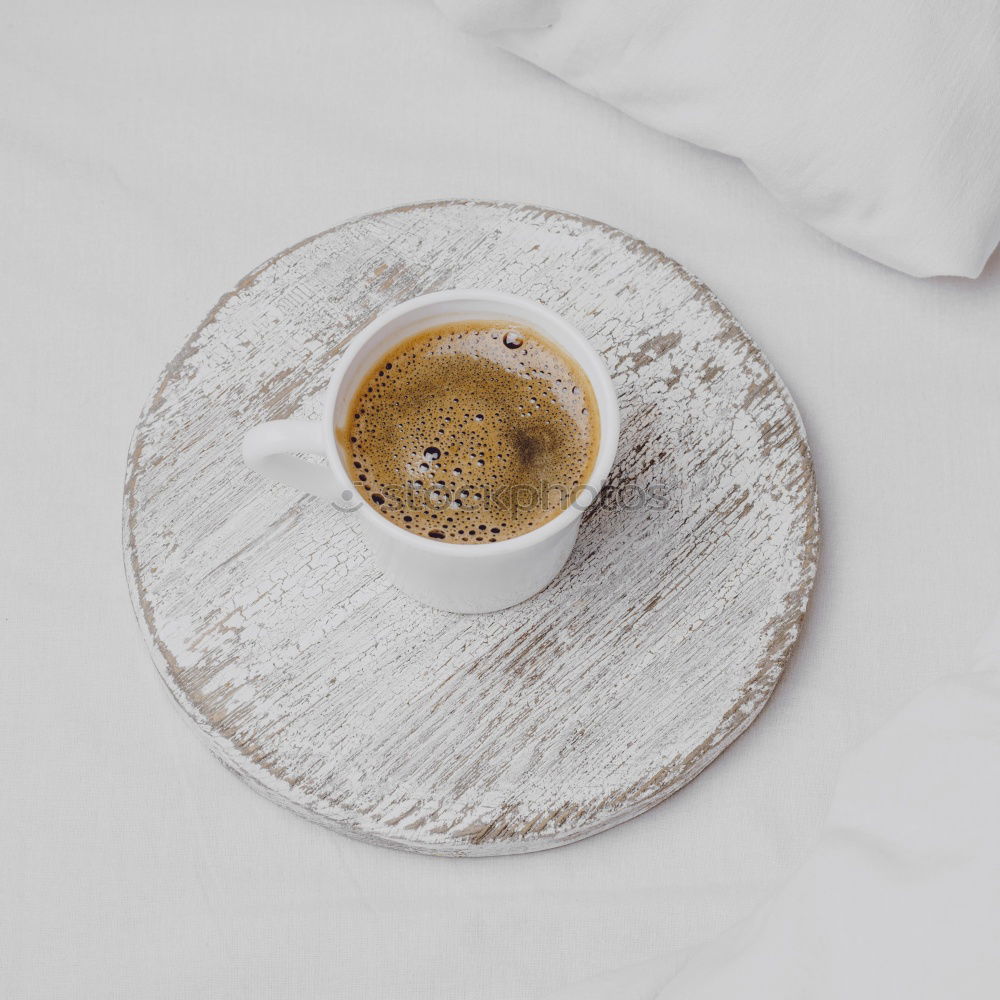 Similar – Image, Stock Photo Cup of coffee and spoon on wooden tray in bed on white sheets