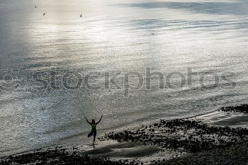 Similar – A young person on the beach of Hiddensee in bright sunshine